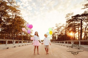 kids with balloons on a bridge kids with balloons on a bridge